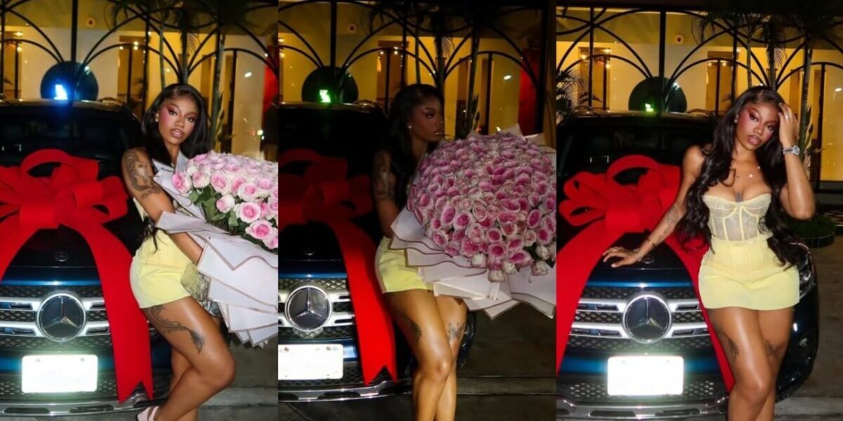Angel Smith shows off the new car and flowers she received from her man